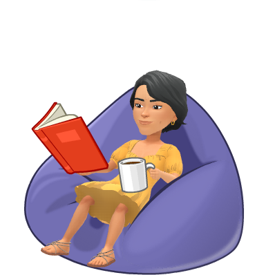 A person chilling on a bean bag chair while reading and drinking coffee.